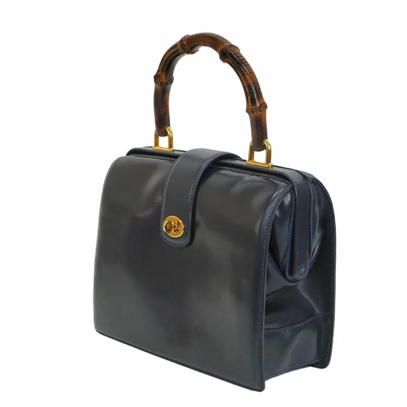 Women Gucci Sylvie bags featuring the signature web stripeGucci Old Bamboo Handbag Gold Crest Navy Leather Women's