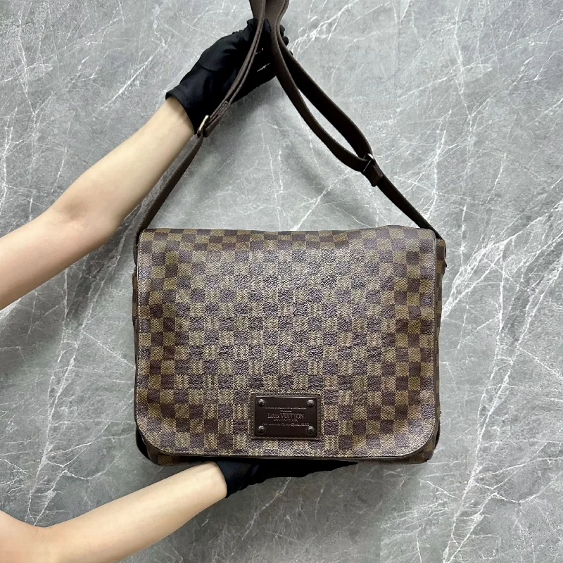 Louis Vuitton bags with a snap - button closure and a decorative charm for styleLV Messenger Brooklyn Naviglio Damiar Bag