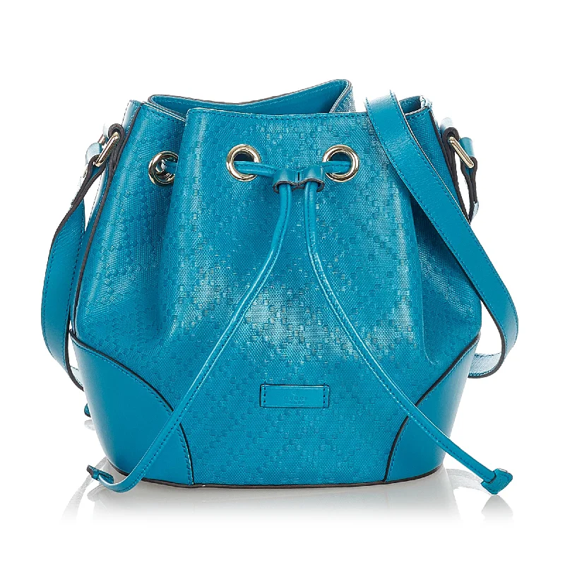 Women Gucci bags with a snap - button closure and a decorative charmGucci Diamante Bright Leather Bucket Bag