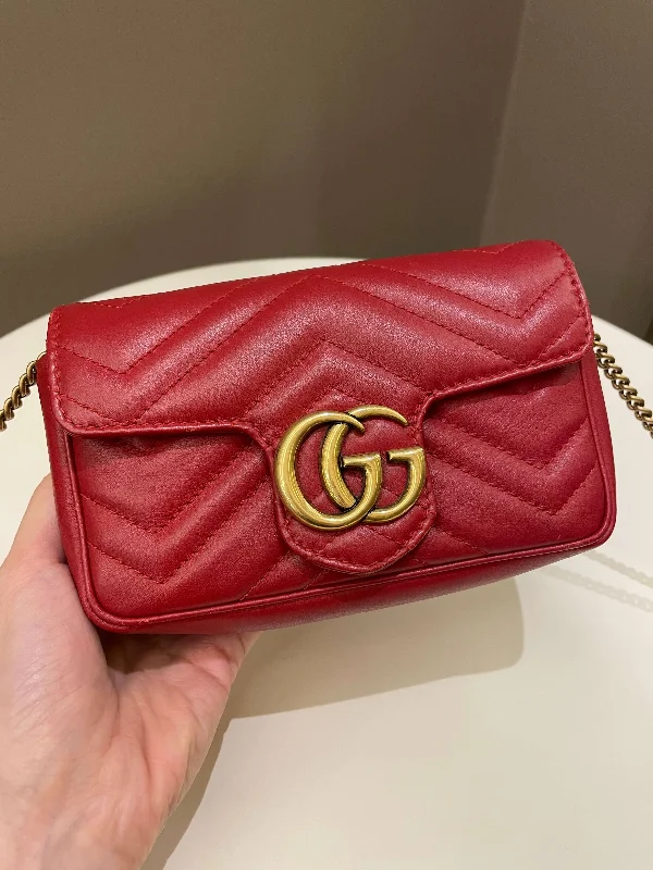 Ladies Gucci shoulder bags with a tassel decorationGucci Marmont Extra Mini Red Lambskin