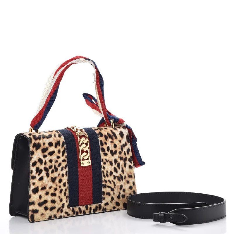 Women Gucci Sylvie bags with a crystal - embellished web stripeGucci Sylvie Shoulder Leopard Print Bag