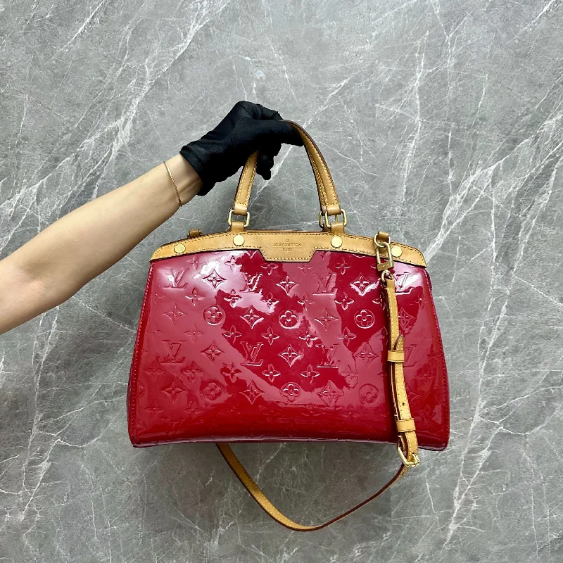 Louis Vuitton bags with a snap - button closure and a decorative charm for styleLV Brea PM Vernis Red Patent Leather