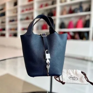 Hermès Kelly Bags in a deep indigo blue for a classic and sophisticated lookHermes Picotin 18 X Stamp Dark Blue Taurillon Clemence SHW