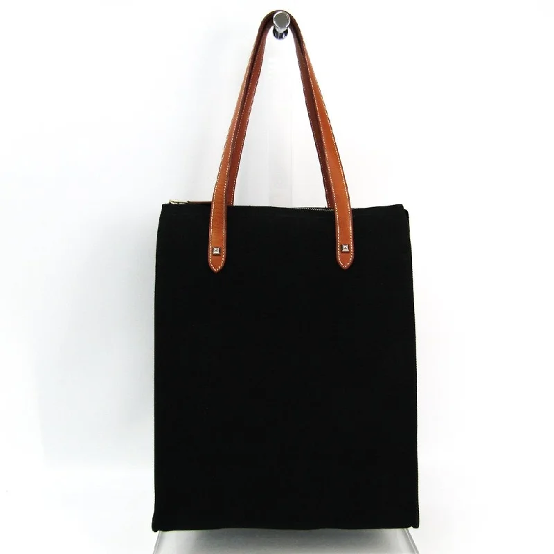 Hermès Kelly Bags with a double - handle option for easy carryingHermes Black Canvas Cabas Mira Tote (SHA11421)