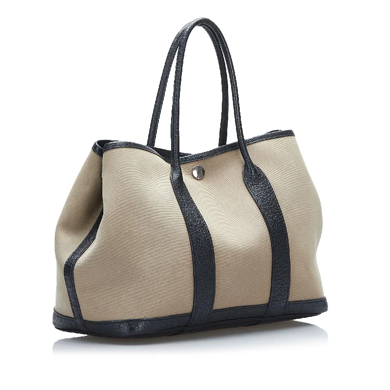 Hermès Kelly Bags with a hand - burnished edge finish for a vintage charmHermes Garden Party 30 (SHG-37802)