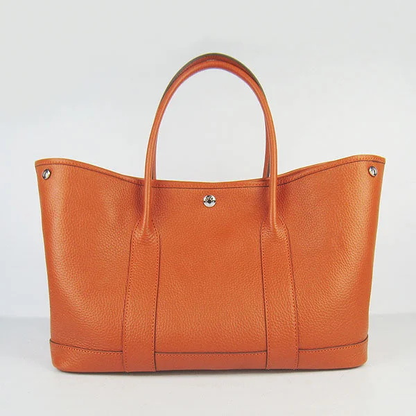 Hermès Kelly Bags in a bold orange for a standout appearanceHermes garden party handbag H2808 orange